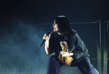 Billie Eilish Tributes Foo Fighters’ Taylor Hawkins In Stormy Grammys Performance