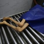 The body of 28-year-old Palestinian Hamada Nael Warsh Agha is brought to Al-Shifa Hospita