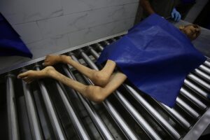 The body of 28-year-old Palestinian Hamada Nael Warsh Agha is brought to Al-Shifa Hospita
