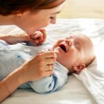 Happy,Young,Mother,Bonding,With,Her,Toddler,Son,In,Blue
