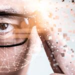 The abstract image of the businessman wear a smart glasses overlay with futuristic hologram. The concept of modern life, technology, iris scanner and internet of things