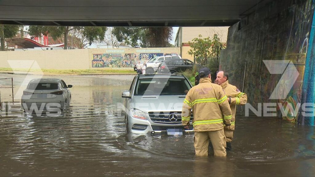 Cars stuck in flooded tunnel in Claremont