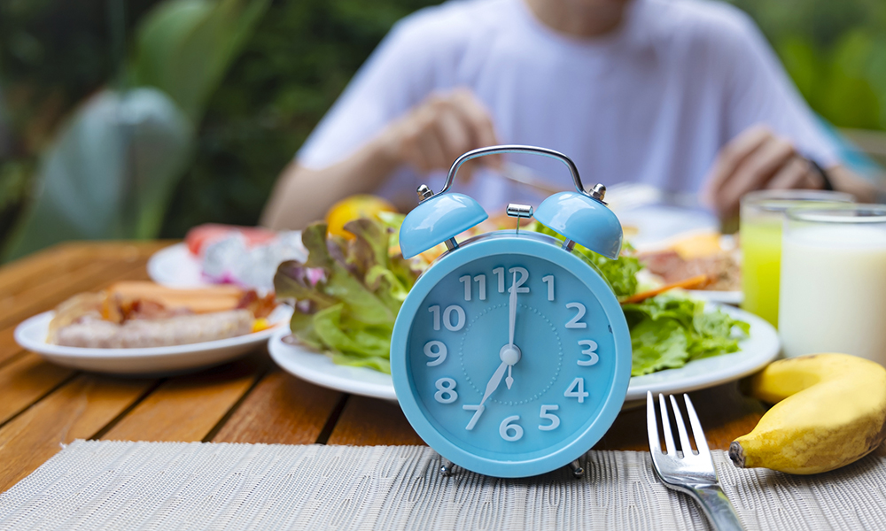 Alarm clock with IF (Intermittent Fasting) 16 and 8 diet rule and weight loss concept.-Diet plan concept