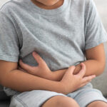 Portrait,Of,Sick,Unhappy,Little,Child,Asian,Boy,Touching,Belly