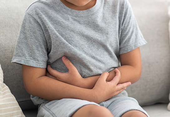 Portrait,Of,Sick,Unhappy,Little,Child,Asian,Boy,Touching,Belly