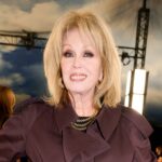 joanna-lumley-sets-fashion-trend-in-wine-red-trench-at-burberry-show