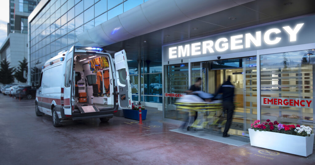 Paramedics, taking patient on stretcher from ambulance to hospital 

Speeding ambulance,(blurred motion)